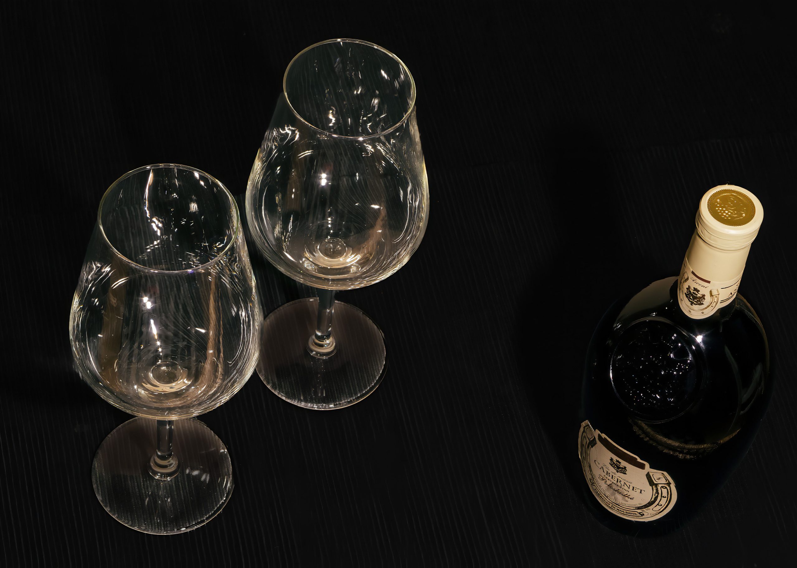 two glasses and bottle of red wine